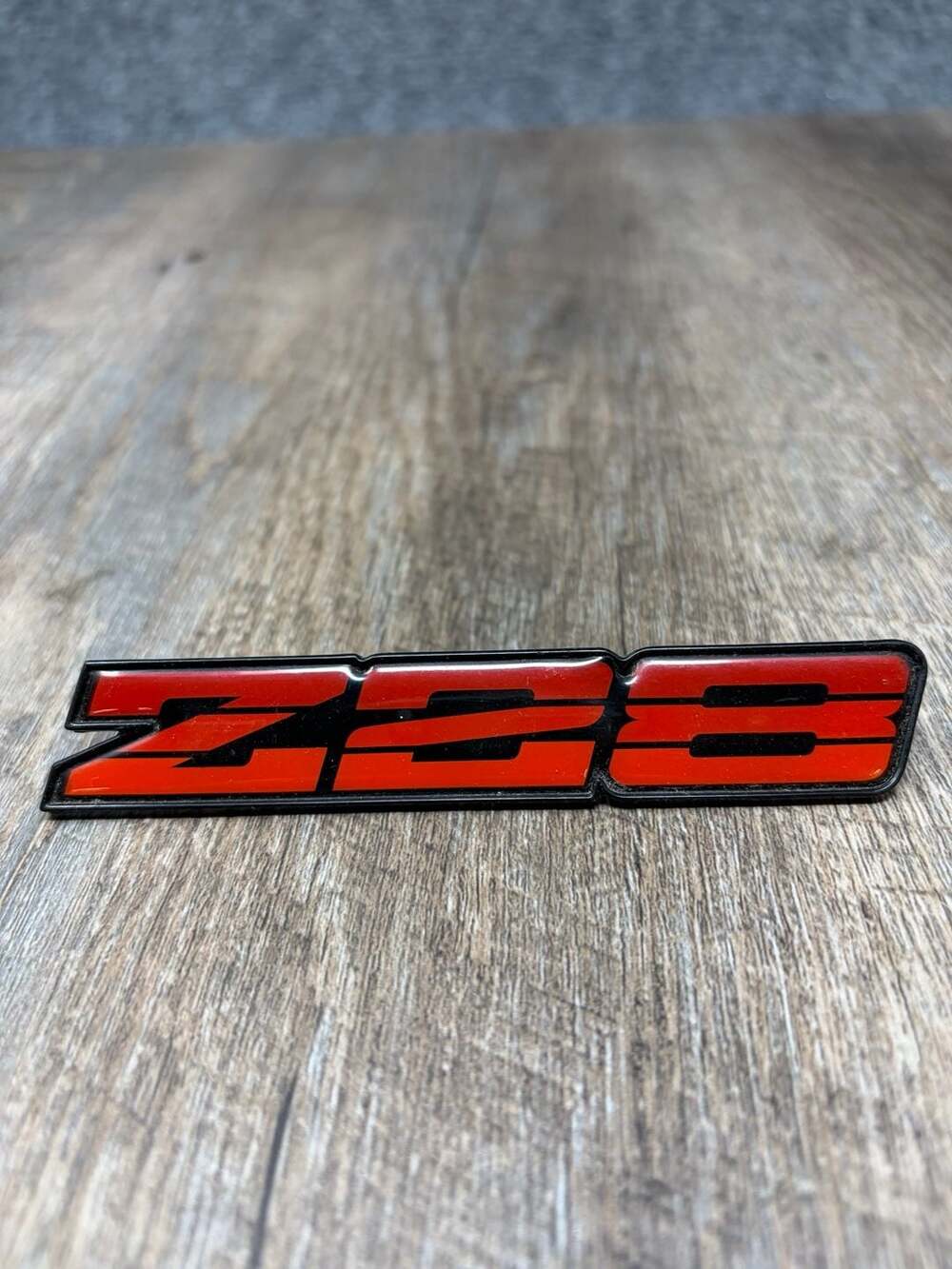 Chevrolet Camaro Z28 Red Rocker Panel Emblem (1982-1984) part-14931725 - OEM-EUC